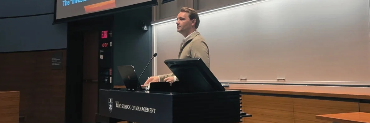 Drew Chapin at the lectern in a Yale School of Management lecture hall