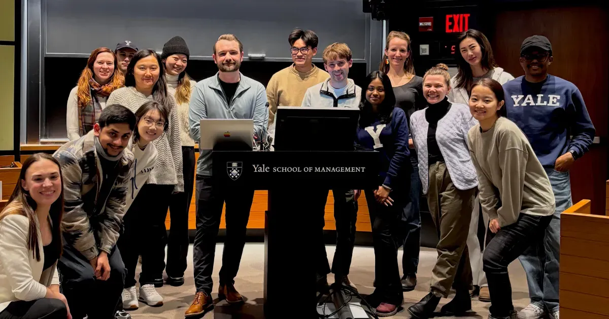 Drew Chapin with students after a class at the Yale School of Management